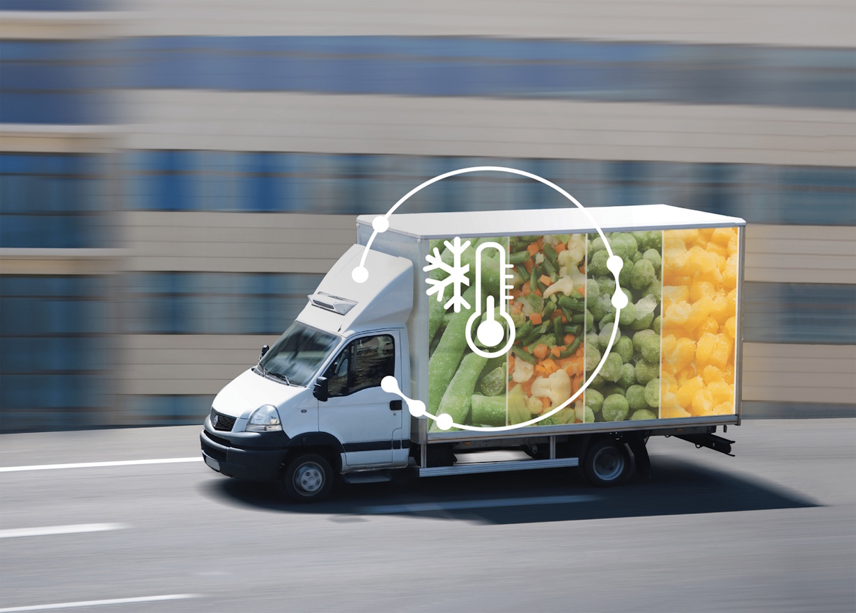 Cold Chain Transport - small refrigerated van with image of frozen vegetables on the side